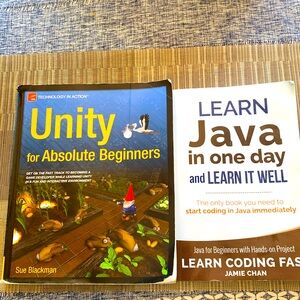 2 computer programming books- Unity and Java